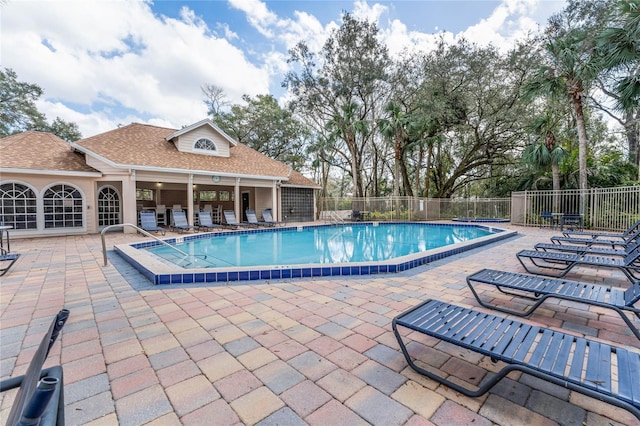 view of swimming pool with a patio area