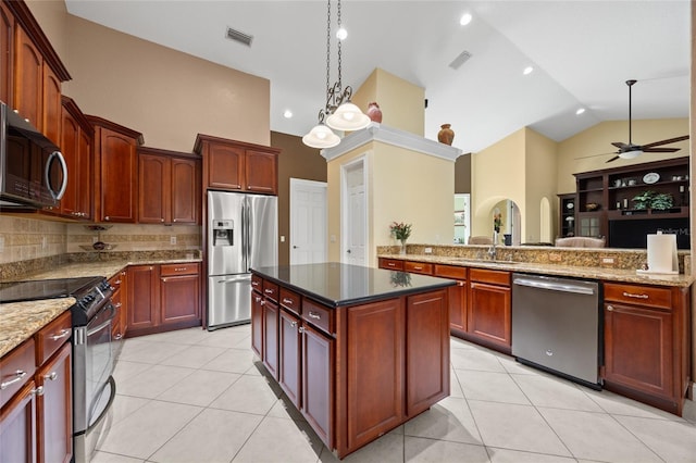 kitchen with appliances with stainless steel finishes, light tile patterned floors, high vaulted ceiling, and ceiling fan