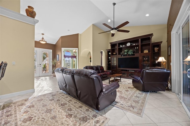 living room with ceiling fan, french doors, high vaulted ceiling, and light tile patterned flooring