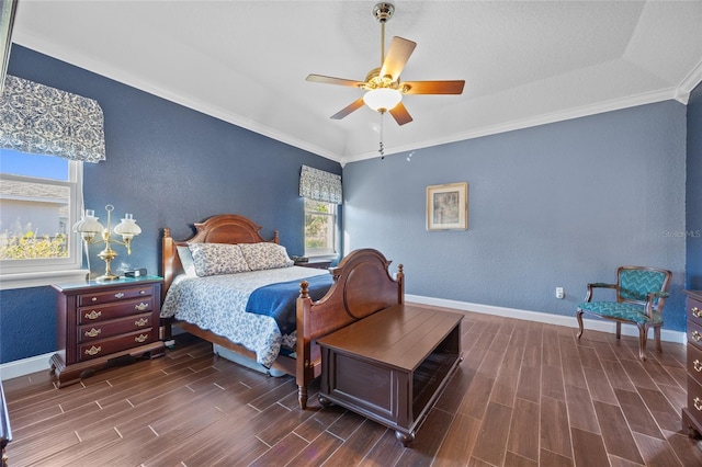 bedroom with dark hardwood / wood-style floors, ceiling fan, and ornamental molding