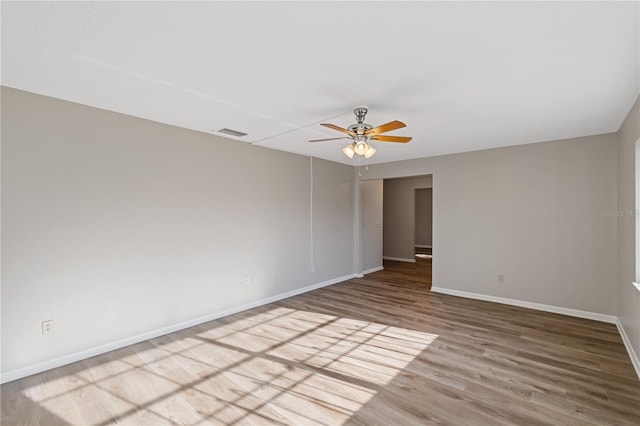 unfurnished room featuring hardwood / wood-style flooring and ceiling fan