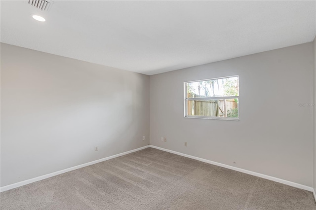 empty room with light colored carpet