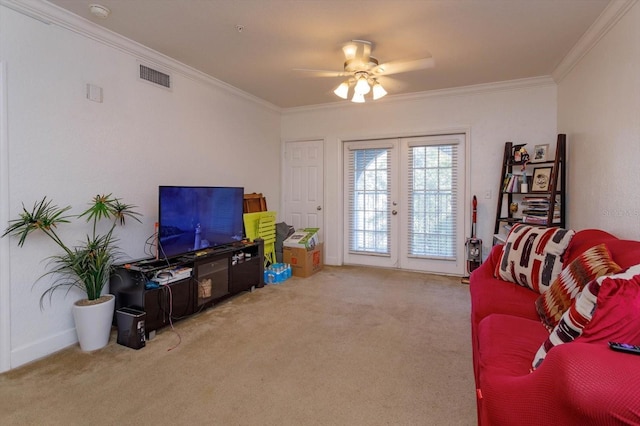 living room featuring carpet, ceiling fan, ornamental molding, and french doors