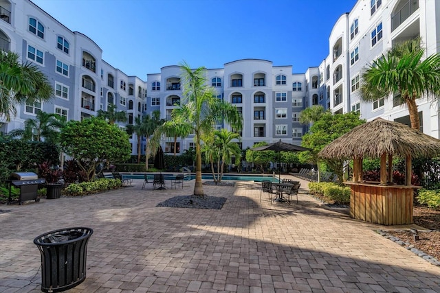 surrounding community featuring a gazebo and a pool