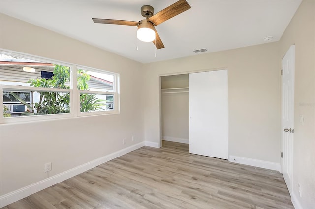 unfurnished bedroom with a closet, ceiling fan, and light hardwood / wood-style floors