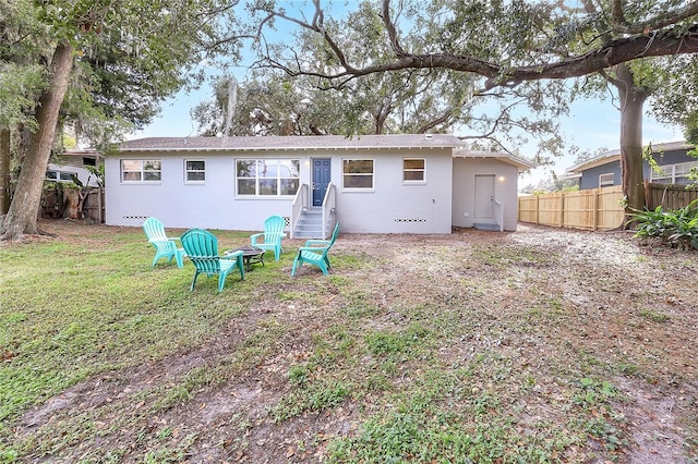 back of house with a yard