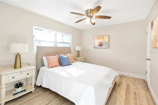 bedroom with ceiling fan and light wood-type flooring