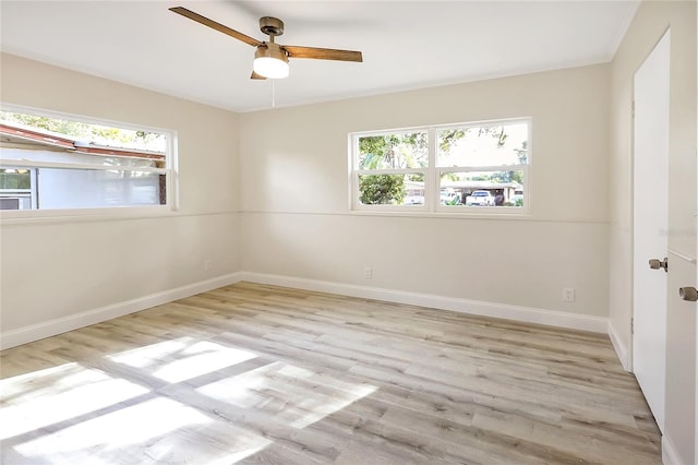 unfurnished room featuring light hardwood / wood-style flooring, plenty of natural light, and ceiling fan