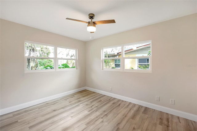 unfurnished room featuring ceiling fan and light hardwood / wood-style floors