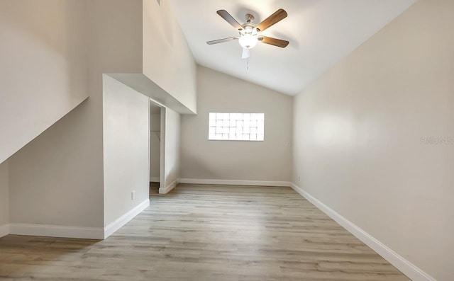 bonus room featuring ceiling fan, light wood-type flooring, and lofted ceiling