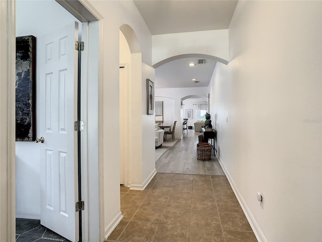 hallway with wood-type flooring