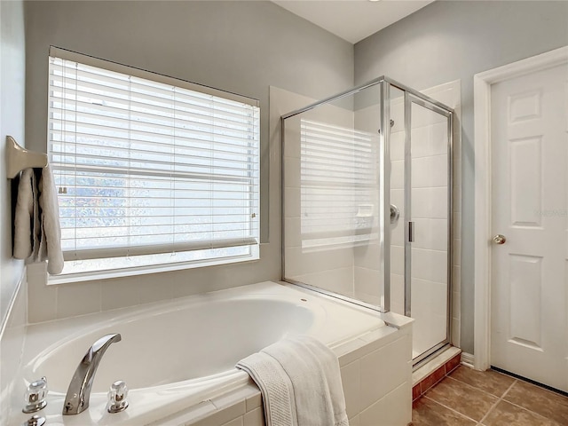 bathroom featuring independent shower and bath and tile patterned floors