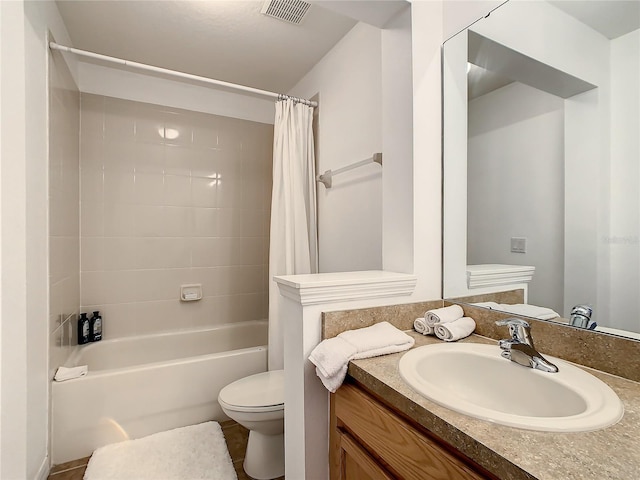 full bathroom featuring shower / bath combination with curtain, vanity, and toilet