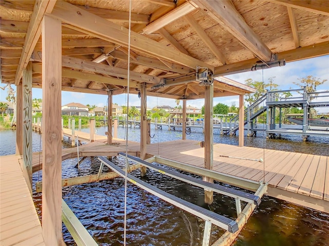 dock area with a water view