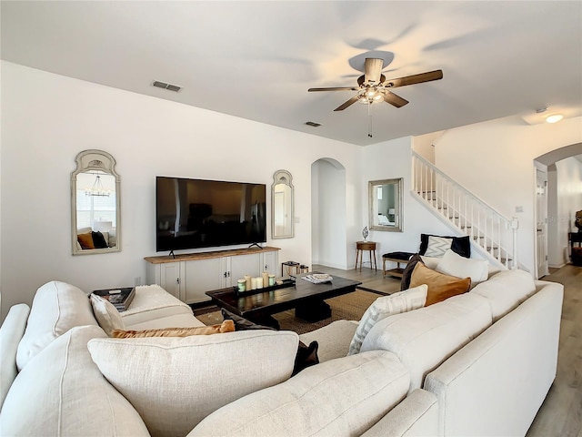 living room featuring light hardwood / wood-style floors and ceiling fan