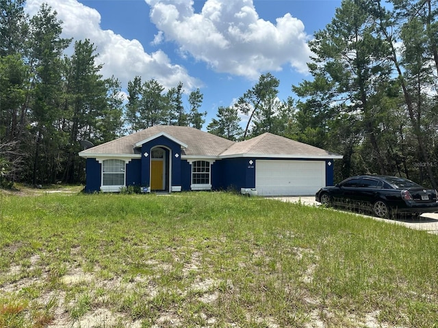 single story home featuring a garage