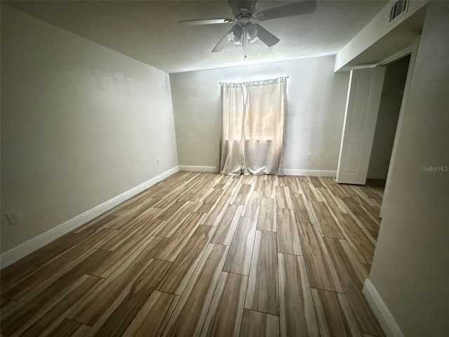 unfurnished room featuring ceiling fan and light hardwood / wood-style flooring