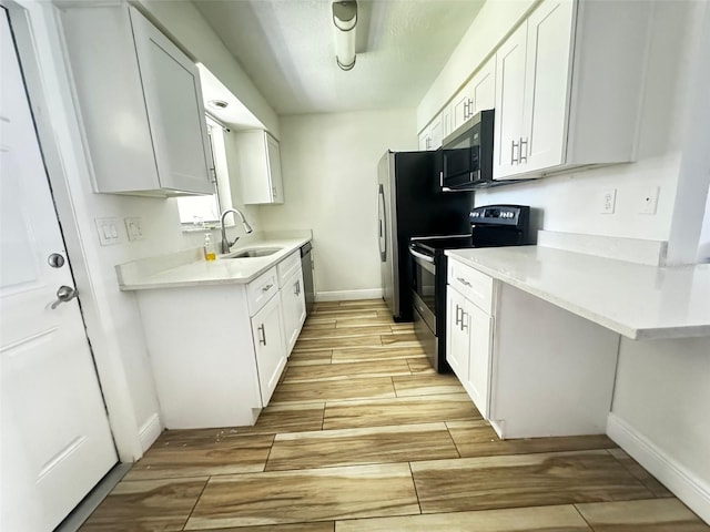 kitchen featuring white cabinetry, sink, and stainless steel appliances