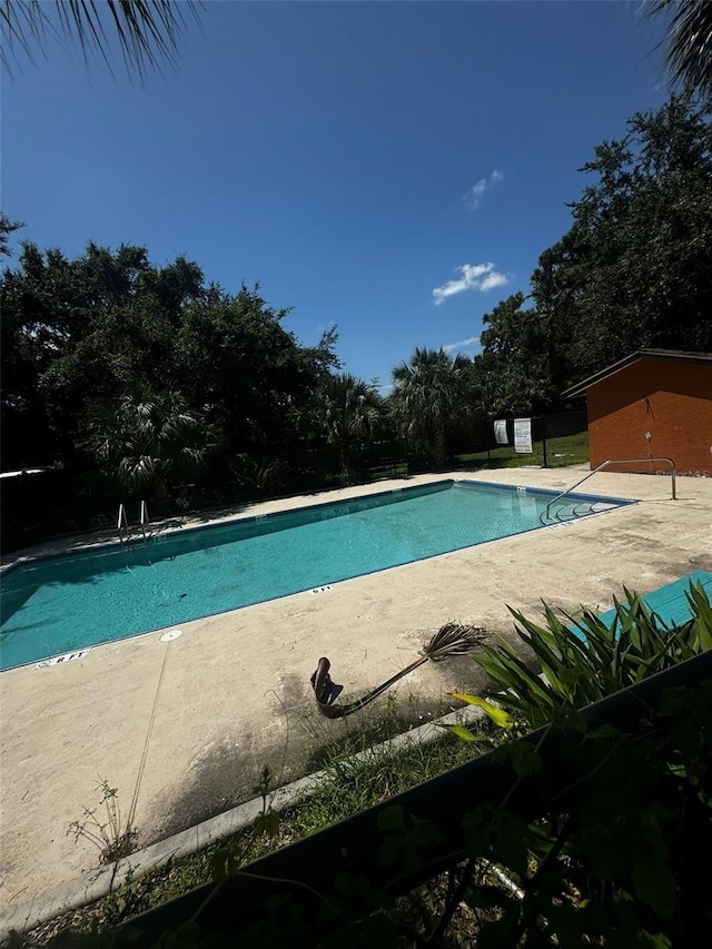 view of swimming pool with a patio area