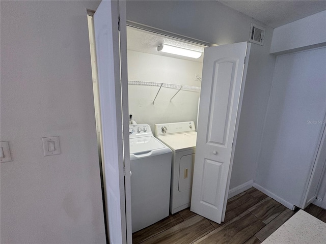 1234 Sago Palm Blvd Unit 1234, Kissimmee, FL 34741 - laundry room with washing machine and dryer, wood finished floors, and baseboards
