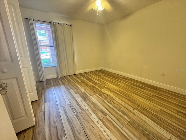 1234 Sago Palm Blvd Unit 1234, Kissimmee, FL 34741 - unfurnished room featuring wood finished floors, baseboards, and a ceiling fan