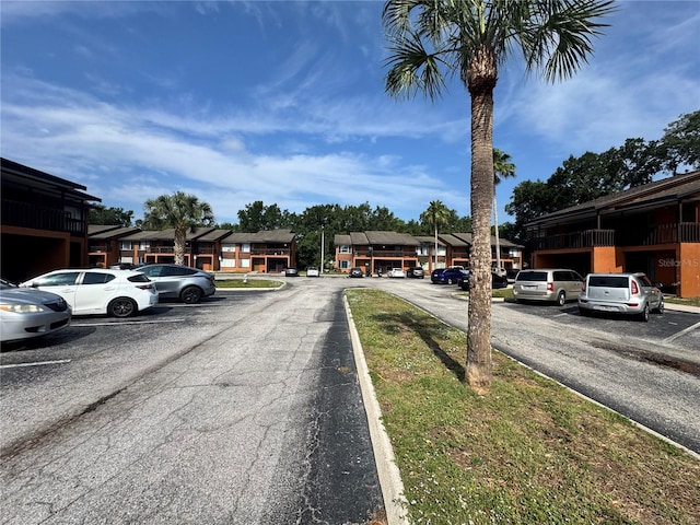 1234 Sago Palm Blvd Unit 1234, Kissimmee, FL 34741 - view of asphalt road featuring a residential view