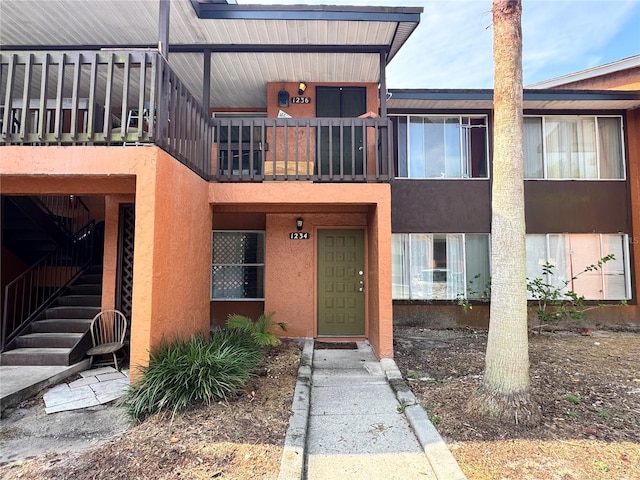 1234 Sago Palm Blvd Unit 1234, Kissimmee, FL 34741 - view of front of home with a balcony and stucco siding