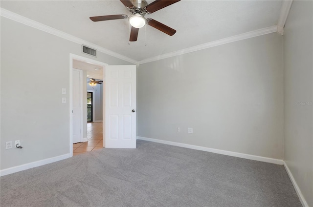 empty room featuring light carpet and ornamental molding