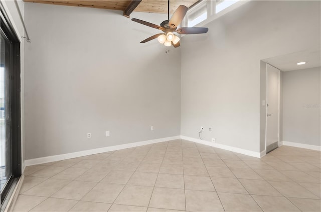 5929 Windhover Dr Unit A02, Orlando, FL 32819 - empty room with light tile patterned floors, ceiling fan, beamed ceiling, and recessed lighting