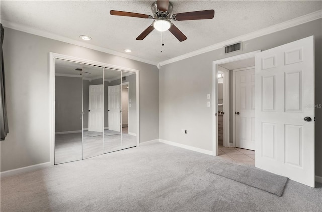 5929 Windhover Dr Unit A02, Orlando, FL 32819 - unfurnished bedroom with light colored carpet, crown molding, recessed lighting, a closet, and a ceiling fan
