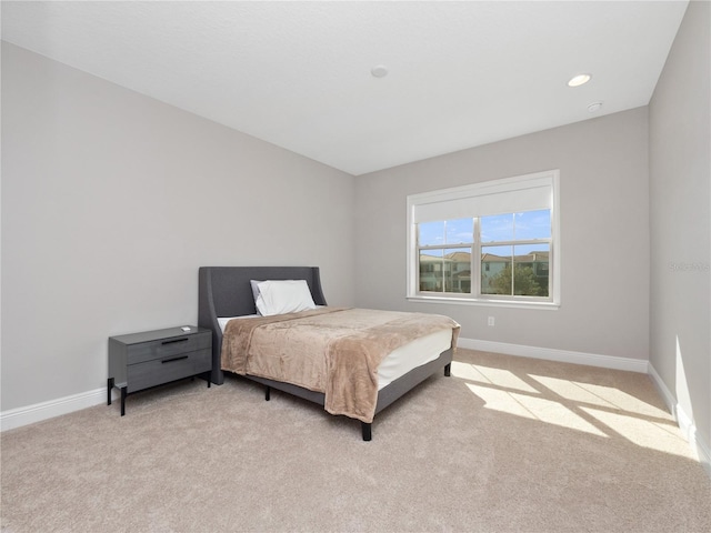 bedroom with light carpet