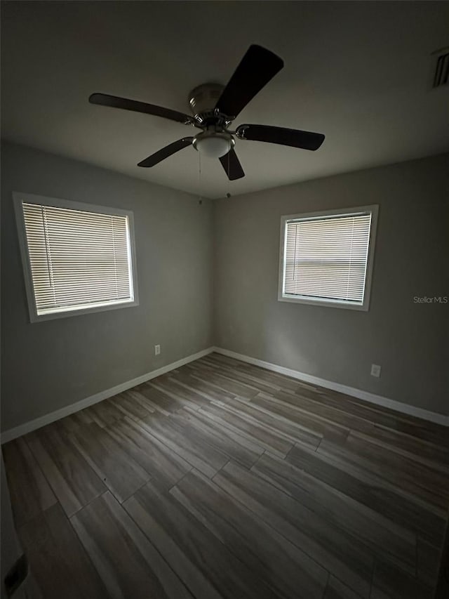 empty room featuring hardwood / wood-style flooring and ceiling fan