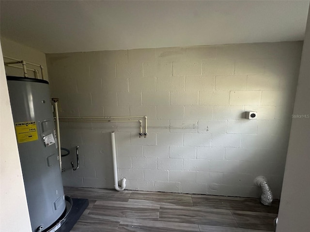 utility room featuring water heater