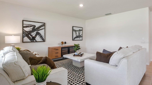 living room with light tile patterned flooring