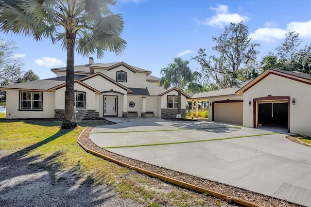 view of front facade with a front lawn and a garage