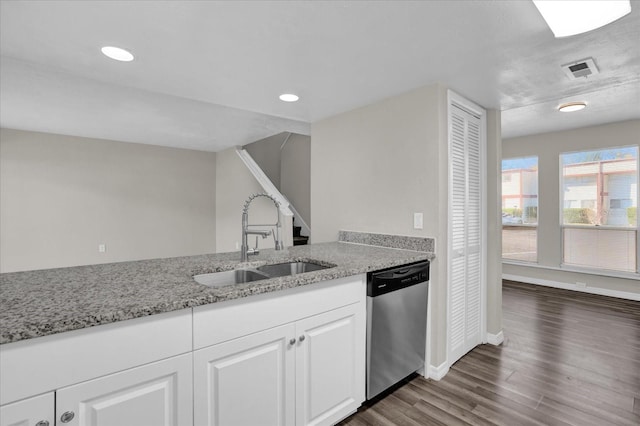 kitchen with white cabinets, light stone counters, dark wood-type flooring, sink, and dishwasher