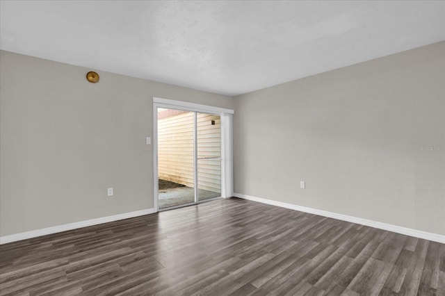 empty room featuring dark wood-type flooring