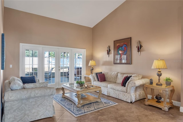 tiled living room with french doors and high vaulted ceiling