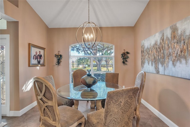 tiled dining area with an inviting chandelier and lofted ceiling