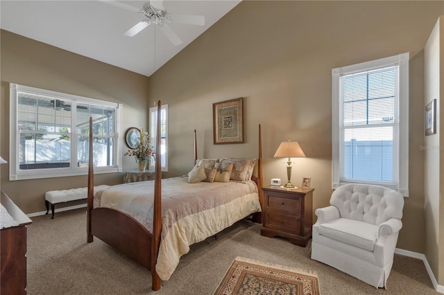 bedroom with ceiling fan, high vaulted ceiling, and light colored carpet