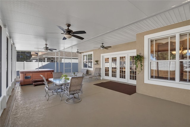 view of patio with french doors and a hot tub