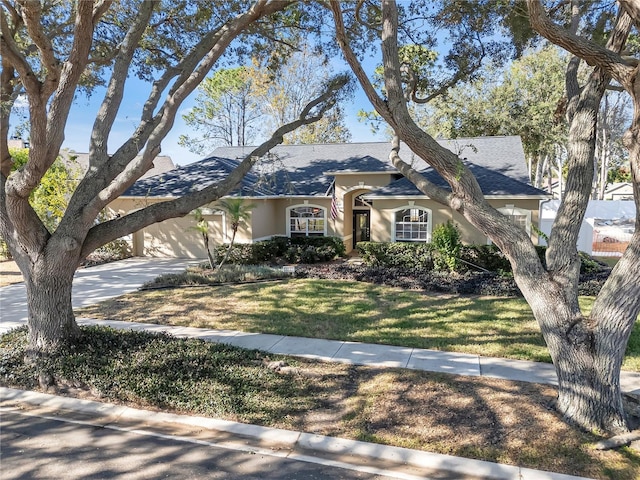 ranch-style home featuring a front yard