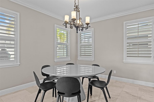 dining space featuring crown molding and an inviting chandelier