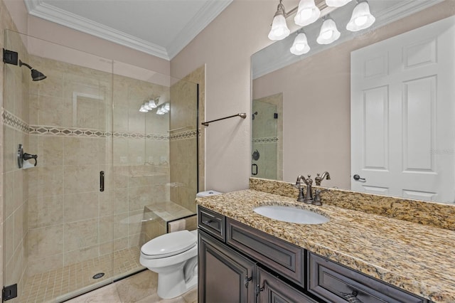 bathroom with vanity, toilet, a shower with shower door, and crown molding