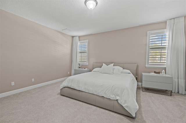 carpeted bedroom with a textured ceiling