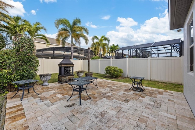 view of patio with a lanai