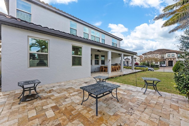 view of patio / terrace featuring ceiling fan