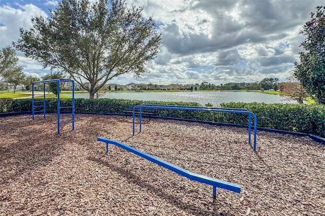 surrounding community featuring a water view and a playground