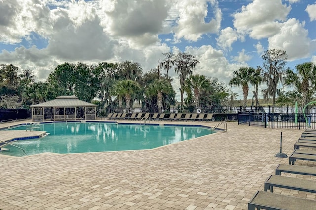 view of swimming pool with a patio area