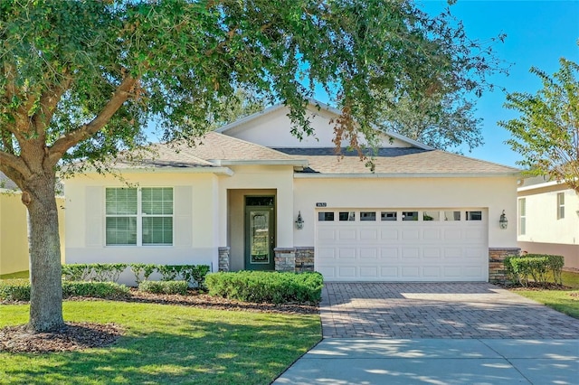 view of front facade with a front yard and a garage